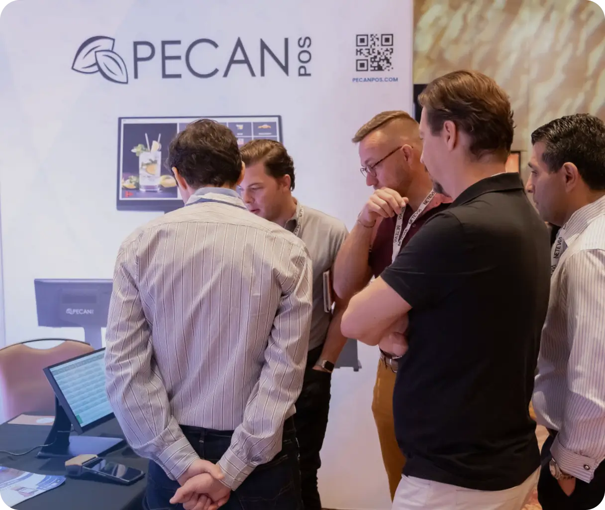 People viewing payment technology at the expo