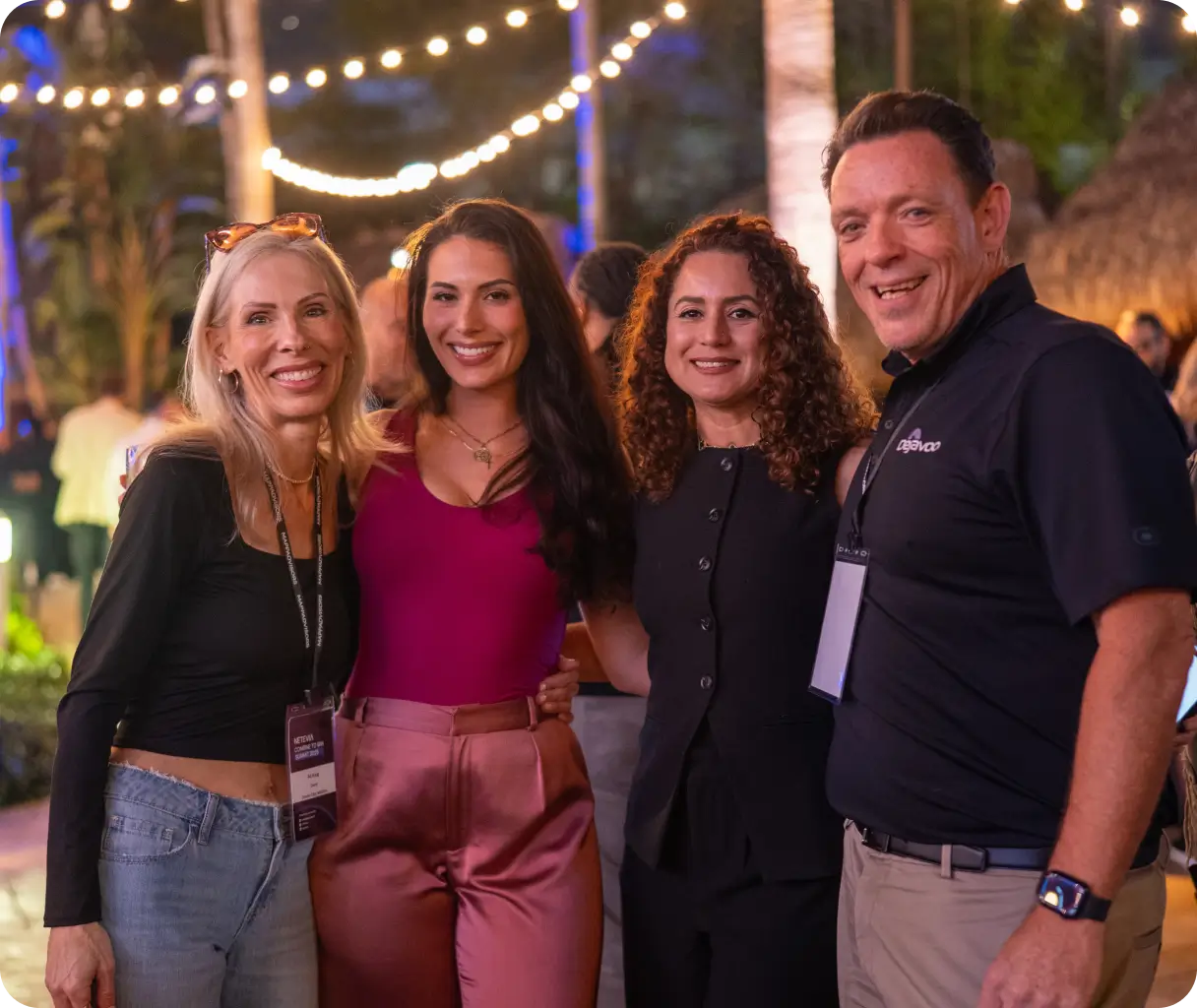 Conference attendees networking at an evening event